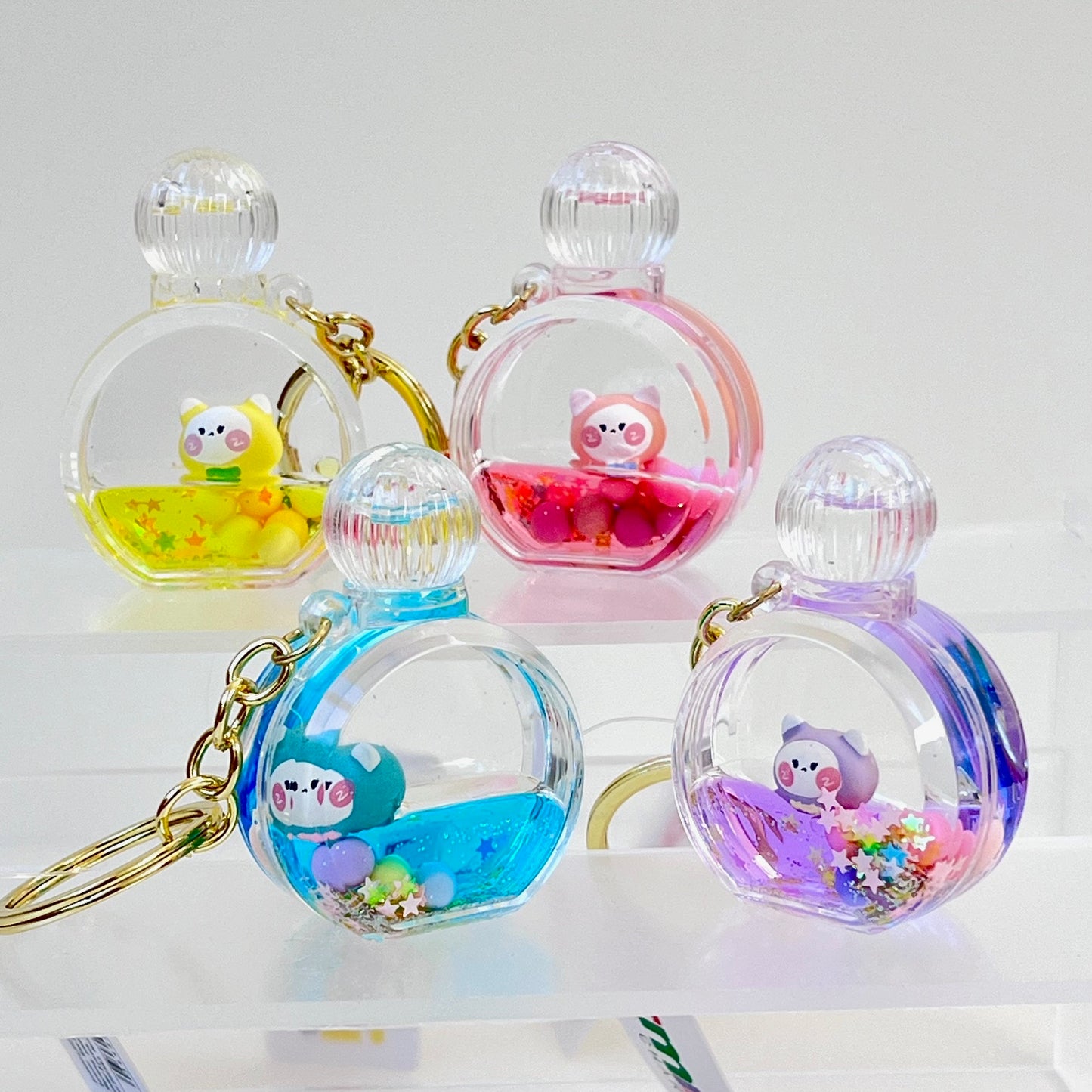 12114 KITTY PERFUME BOTTLE FLOATY KEY CHARM-12