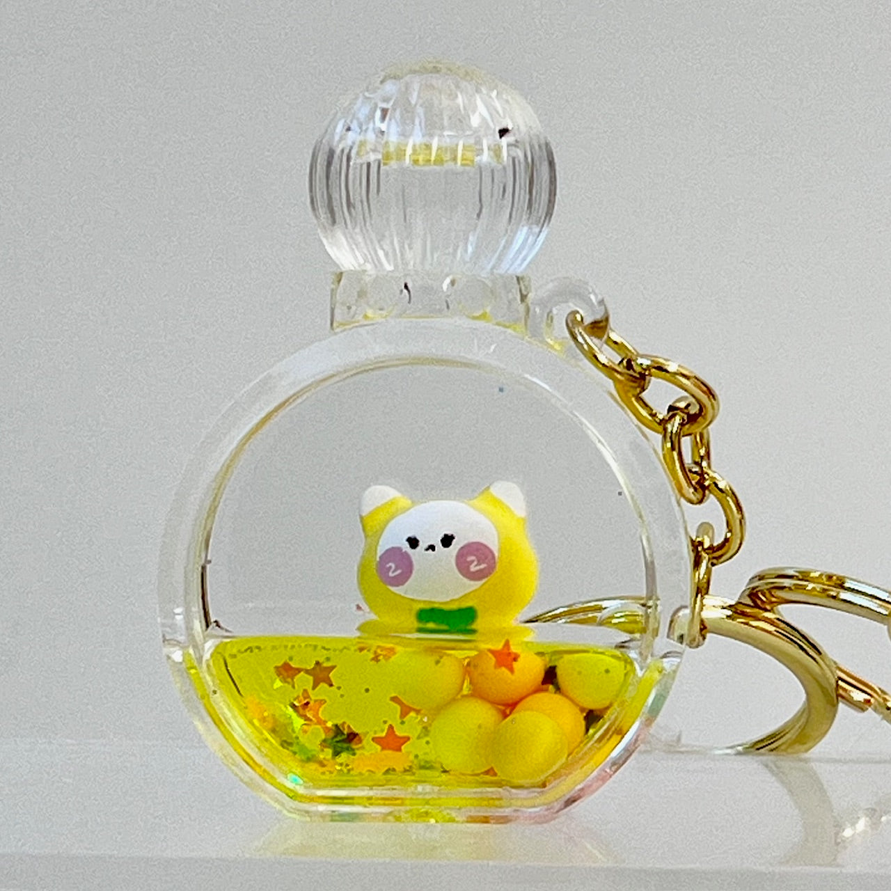 12114 KITTY PERFUME BOTTLE FLOATY KEY CHARM-12