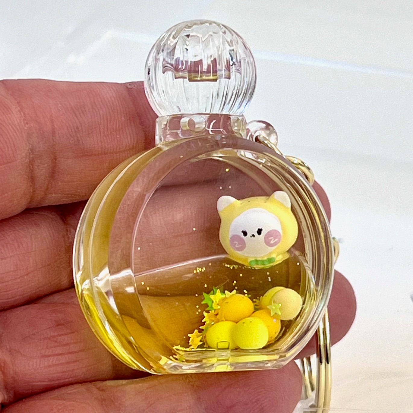 12114 KITTY PERFUME BOTTLE FLOATY KEY CHARM-12