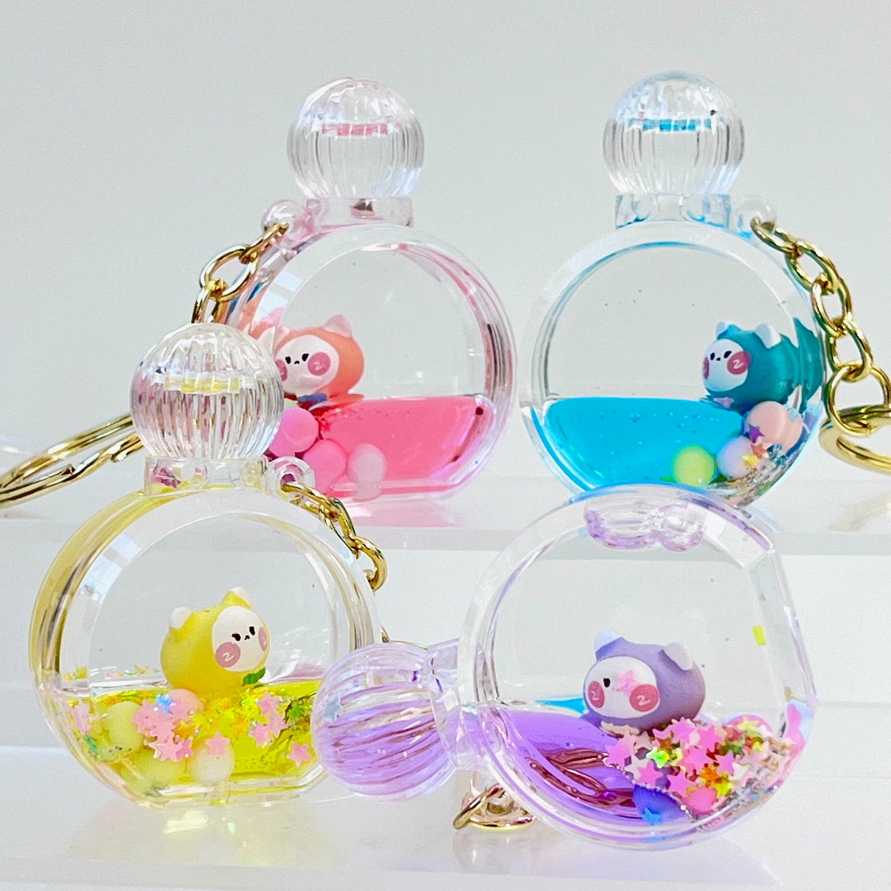 12114 KITTY PERFUME BOTTLE FLOATY KEY CHARM-12
