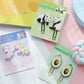 X 12802 AVOCADO PUFFY CLIPS-2 CLIPS-DISCONTINUED