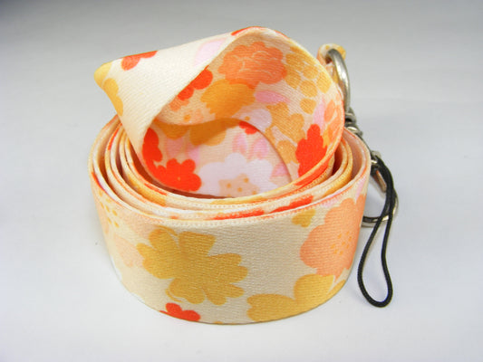 X 80041 ORANGE FLOWER LANYARD-DISCONTINUED